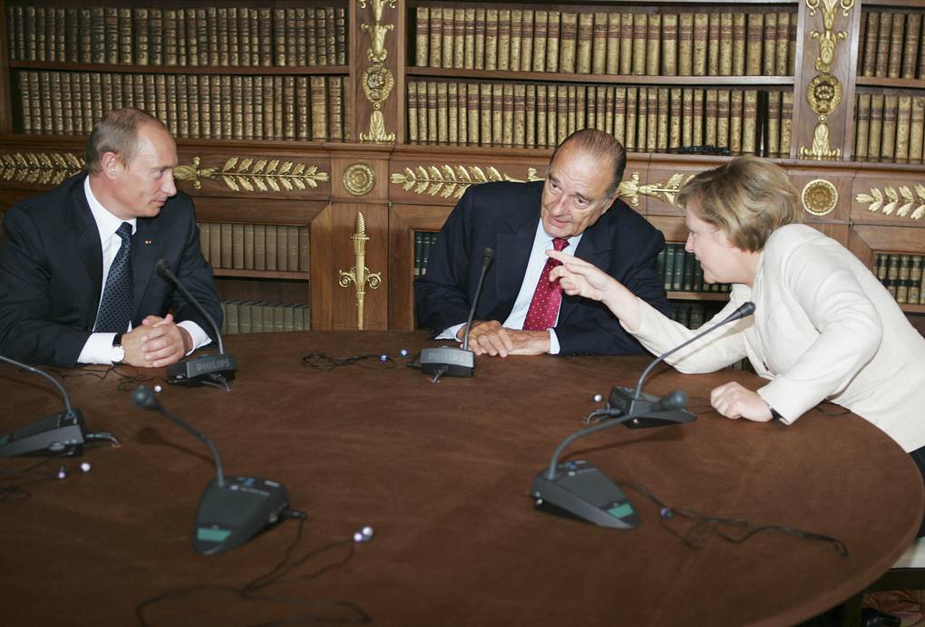 9. Президент России Владимир Путин, президент Франции Жак Ширак и канцлер Германии Ангела Меркель во время встречи в 2006 году